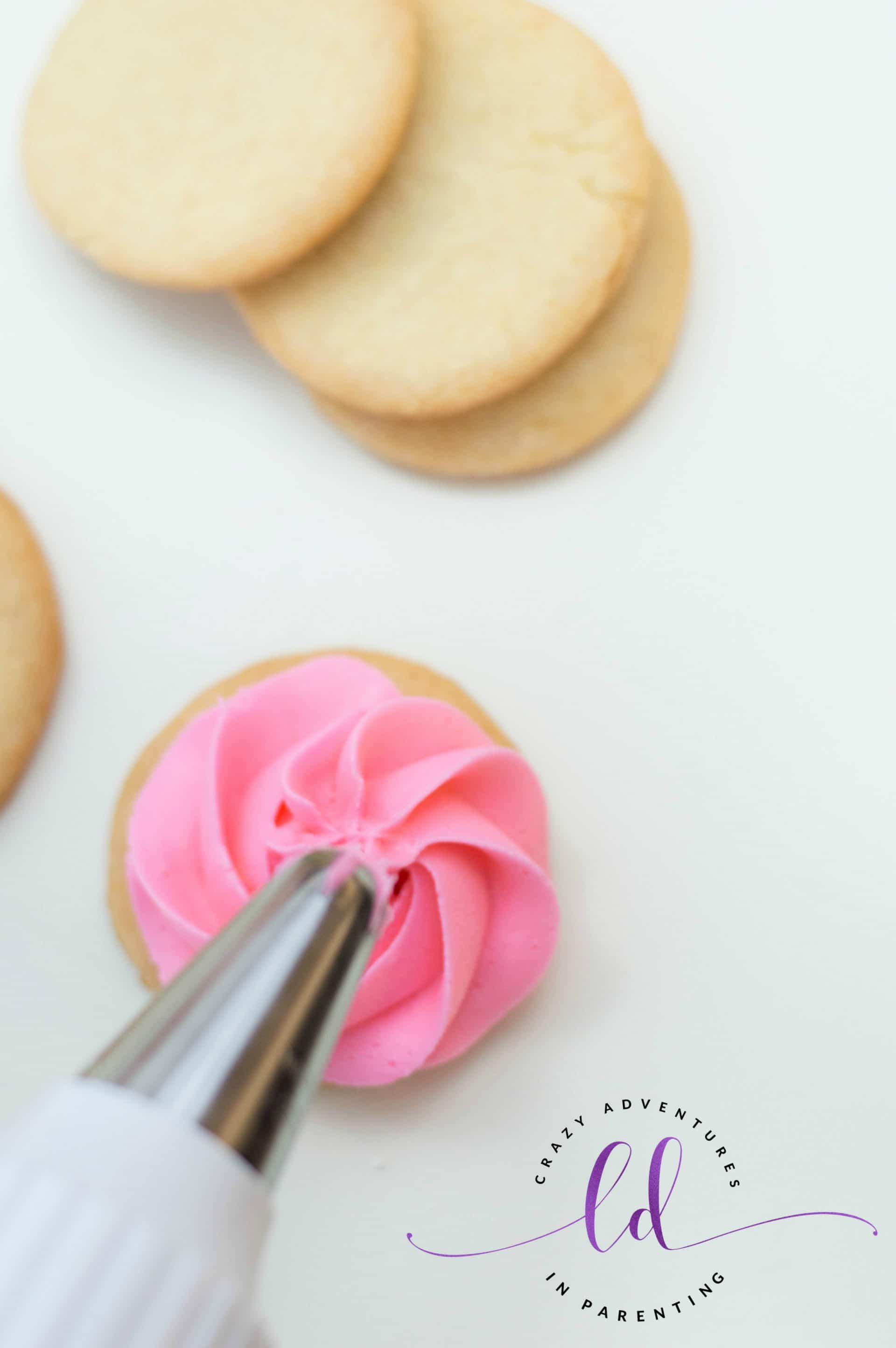 Pipe Pink Buttercream onto Rose Sugar Cookies