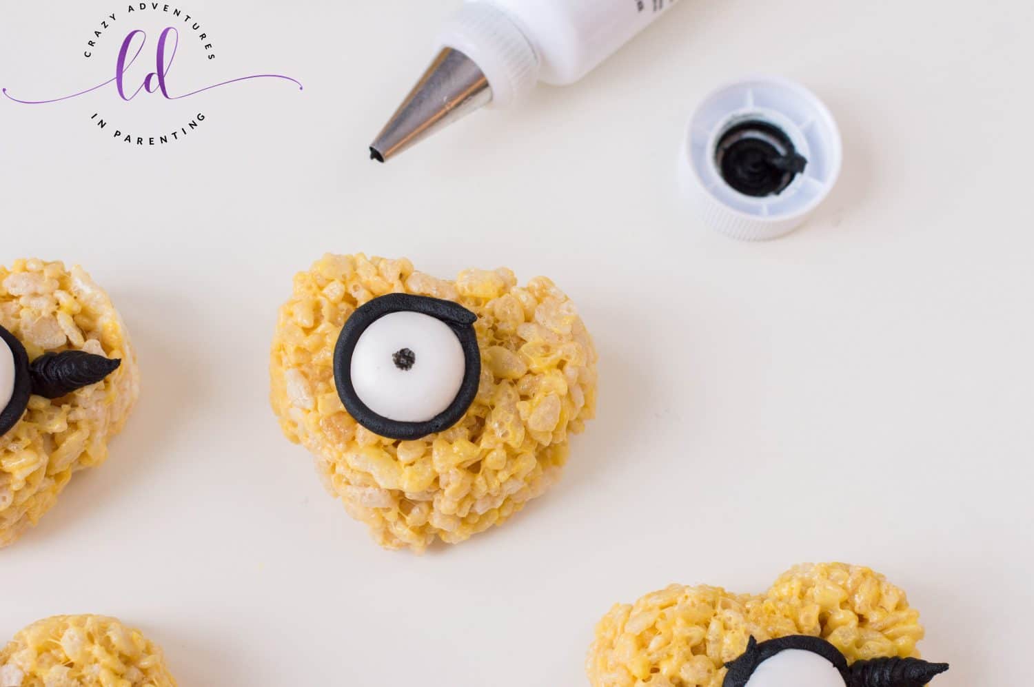 Pipe Frosting onto Minions Valentine's Rice Krispies Treats