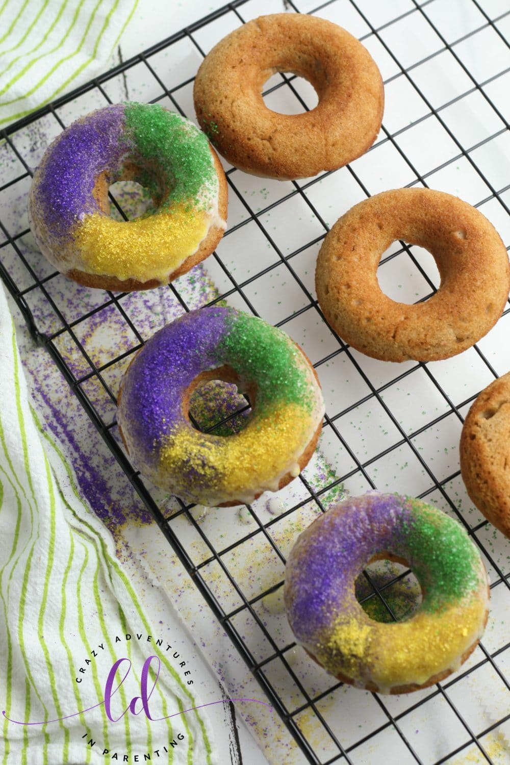 Adding Sprinkles to King Cake Doughnuts