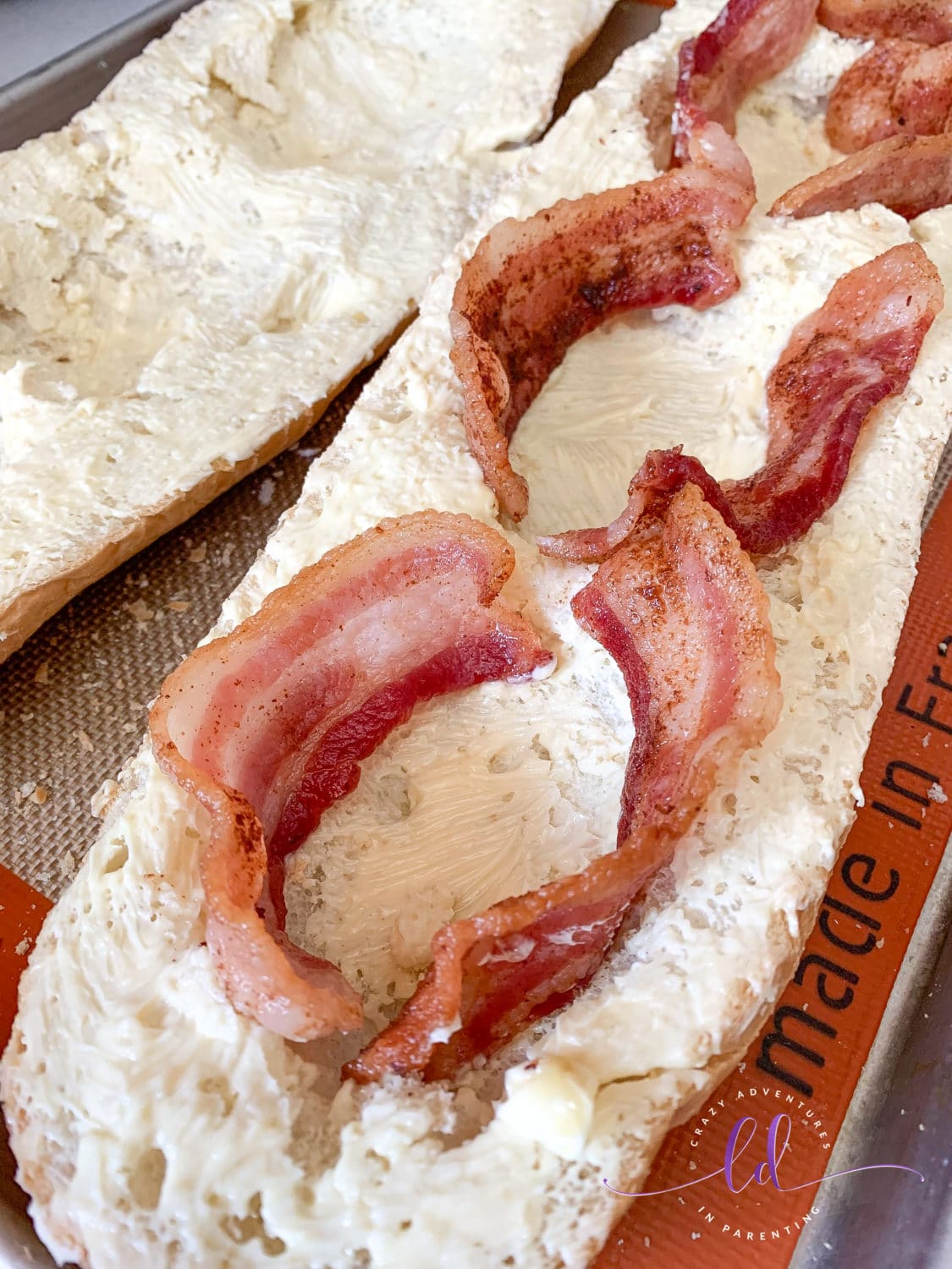 Arrange sliced bacon for Bacon Cheesy Baked Egg Italian Toast
