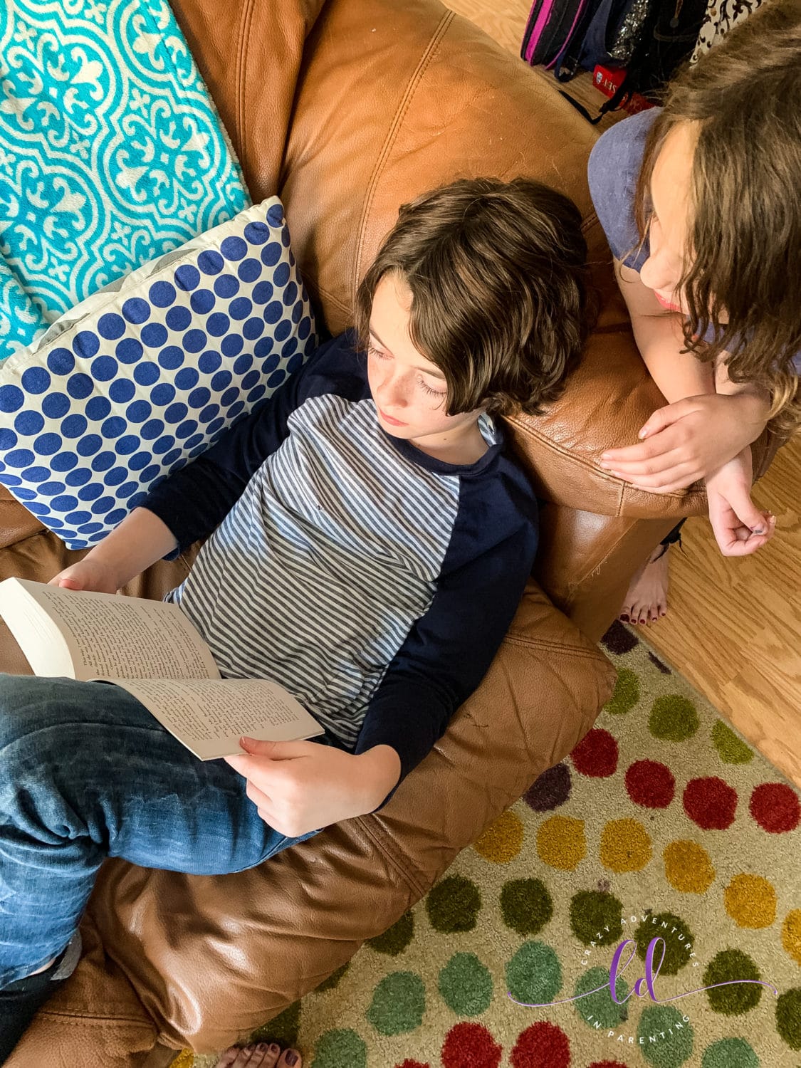 Big Brother Reading Percy Jackson and the Olympians to her