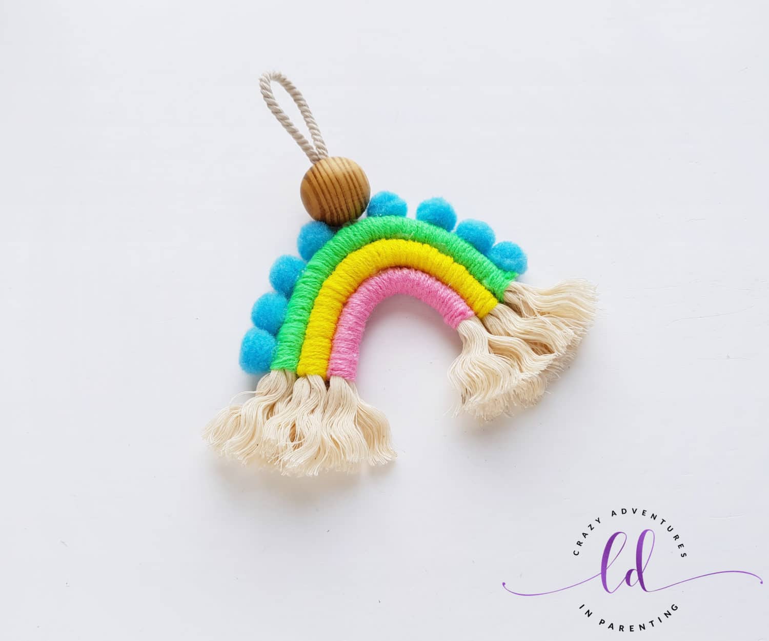 Attach PomPoms and Fray Rope to Make a Macrame Rainbow Charm