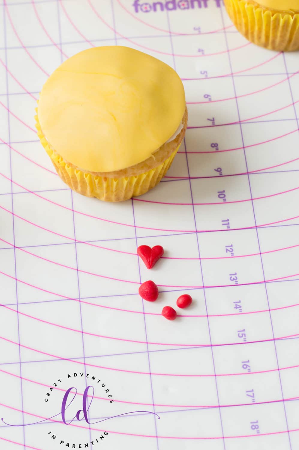 Cut Red Fondant for Heart Eyes Emoji Cupcakes