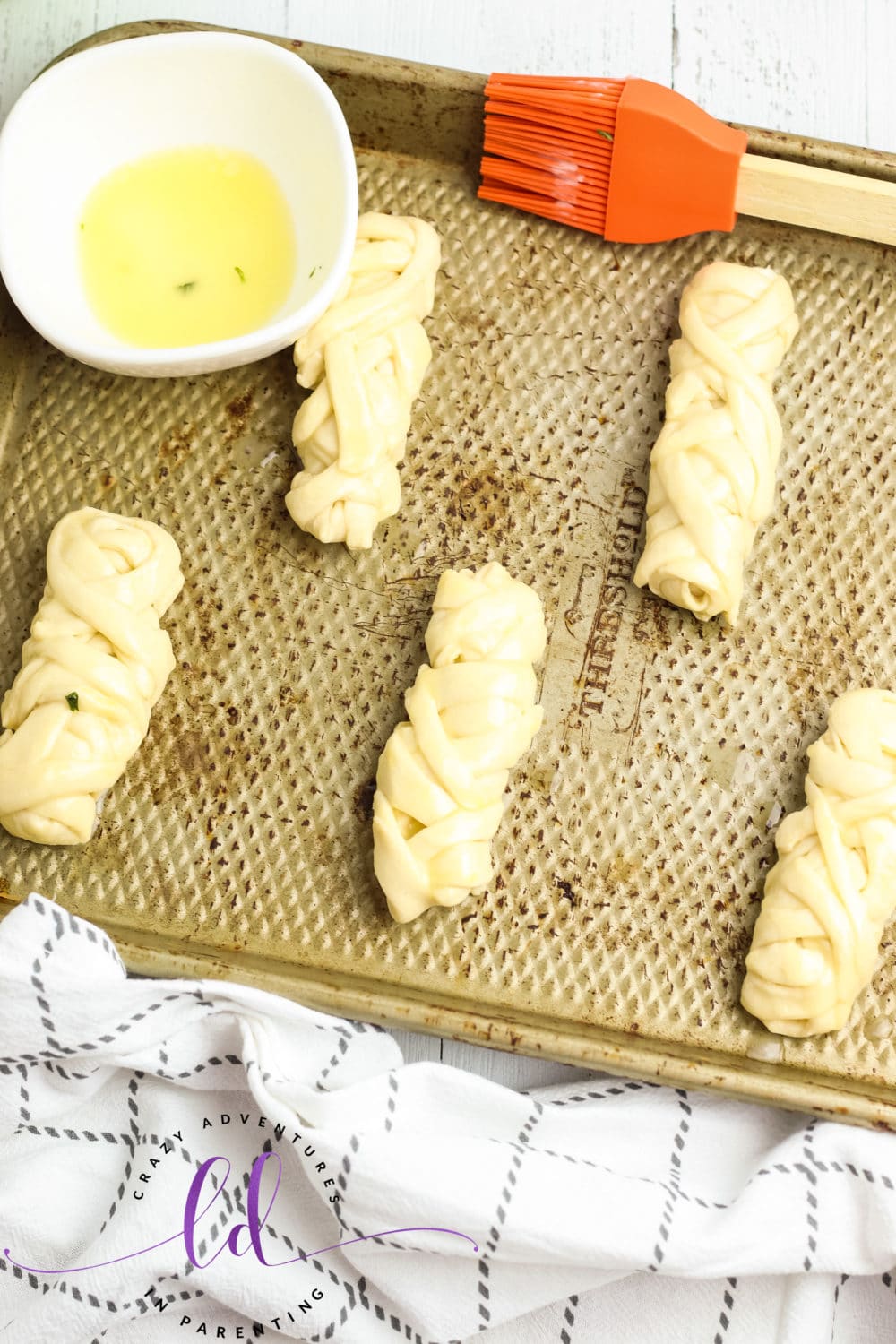 Brush Cheesy Mummy Breadsticks with Butter