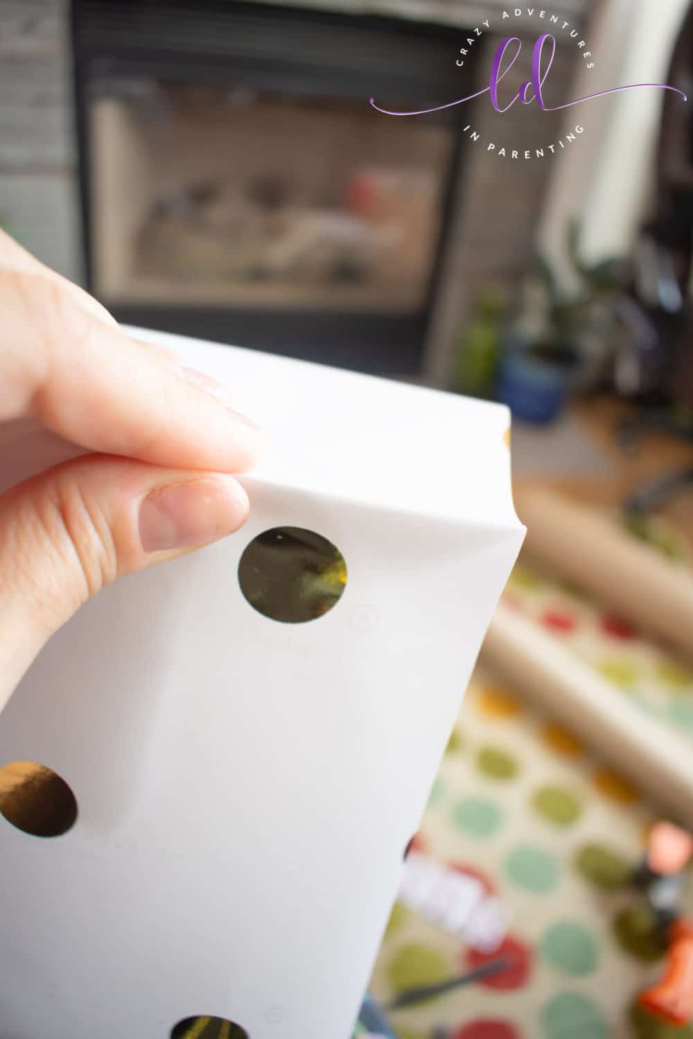 Pinch Corners of Wrapping Paper for DIY Greeting Card Storage Box