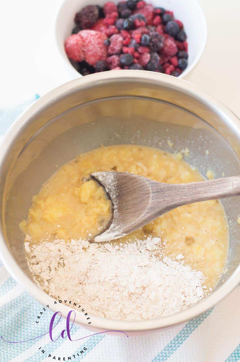 Add Wet Ingredients to Dry Ingredients Bowl for Healthy Berry Muffins