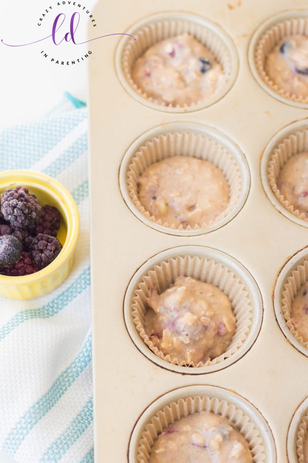 Fill Muffin Cups with Muffin Batter to Prepare Healthy Berry Muffins