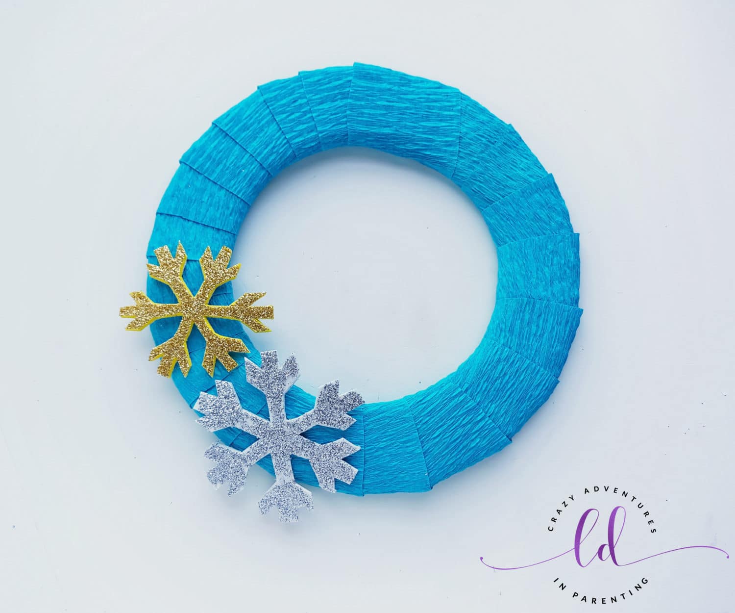 Glue Foam Snowflakes Onto This Easy Frozen Wreath Craft