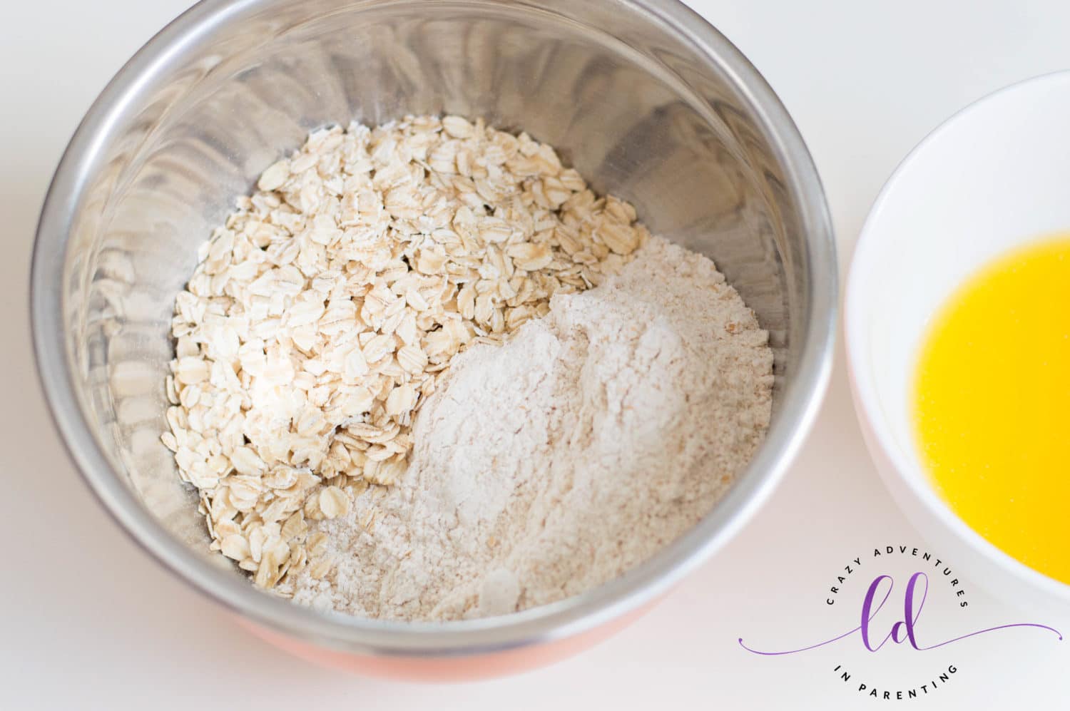 Sift Flour and Add Oatmeal to Bowl for Healthy Berry Muffins