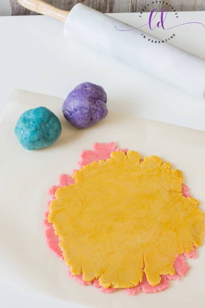 Stack colored dough together to make Rainbow Unicorn Cookies
