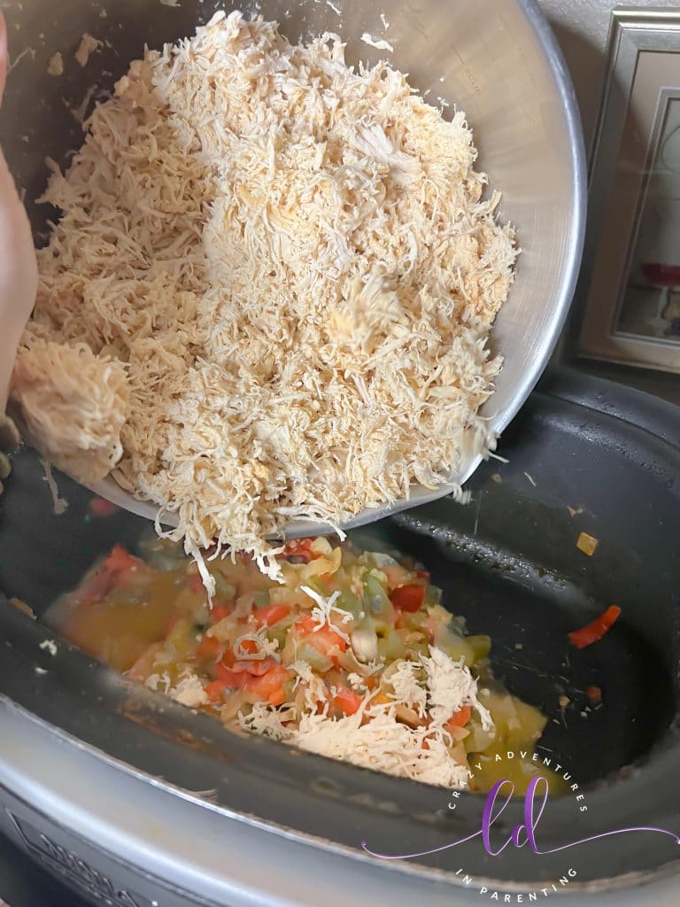Add chicken back into the pot to make Easy Creamy Chicken Tacos Recipe