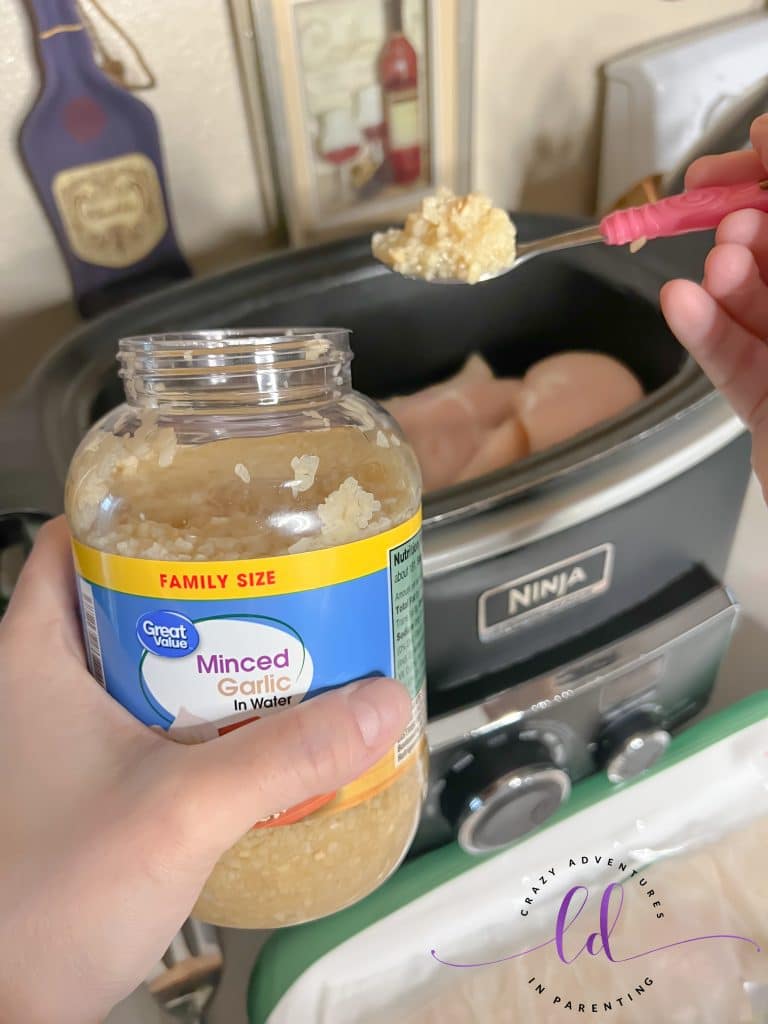 Add minced garlic to the pot to make Easy Creamy Chicken Tacos Recipe