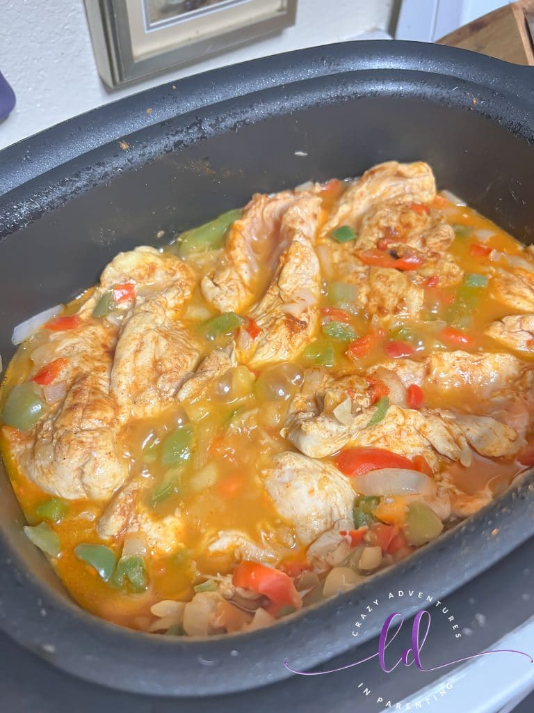 Chicken cooking in the pot to make Easy Creamy Chicken Tacos Recipe