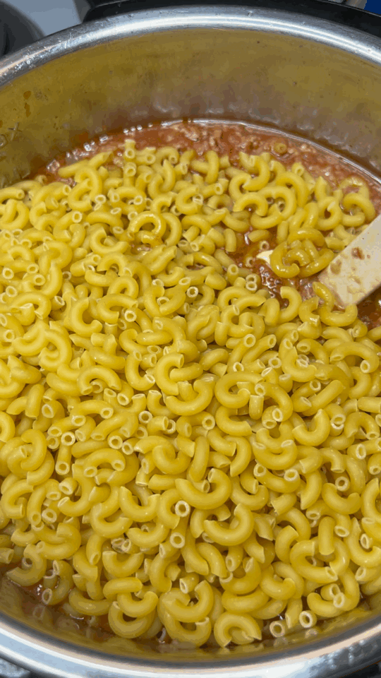 easy instant pot taco macaroni recipe, Stir Pasta in Instant Pot to make Taco Macaroni